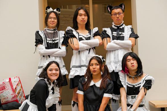 In a scene that would only happen in a manga we have a group portrait of 6 people some male and some female who are dressed in mostly matching maid costumes