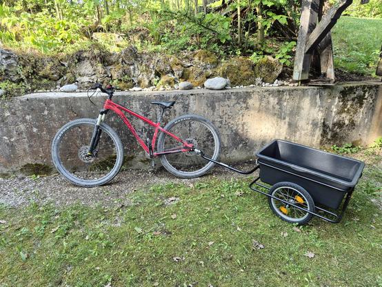 A mtb with a little Bicycle trailer attached