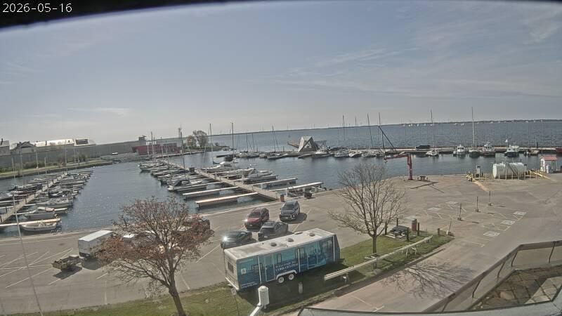 Looking ESE from the roof of Portsmouth Olympic Harbour looking out over the marina and Lake Ontario. // Image captured at: 2026-05-16 13:30:02 UTC (about 1 min. prior to this post) // Image sourced from: cityofkingston.ca // Current Temp in Kingston: 52 F | 11 C // Precip: scattered clouds // Wind: S at 11 mph | 19 kph // Humidity: 76%