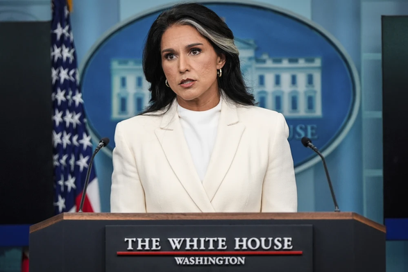 Then National Intelligence Director Tulsi Gabbard stands at a lectern and speaks with reporters in the James Brady Press Briefing Room in July 2025