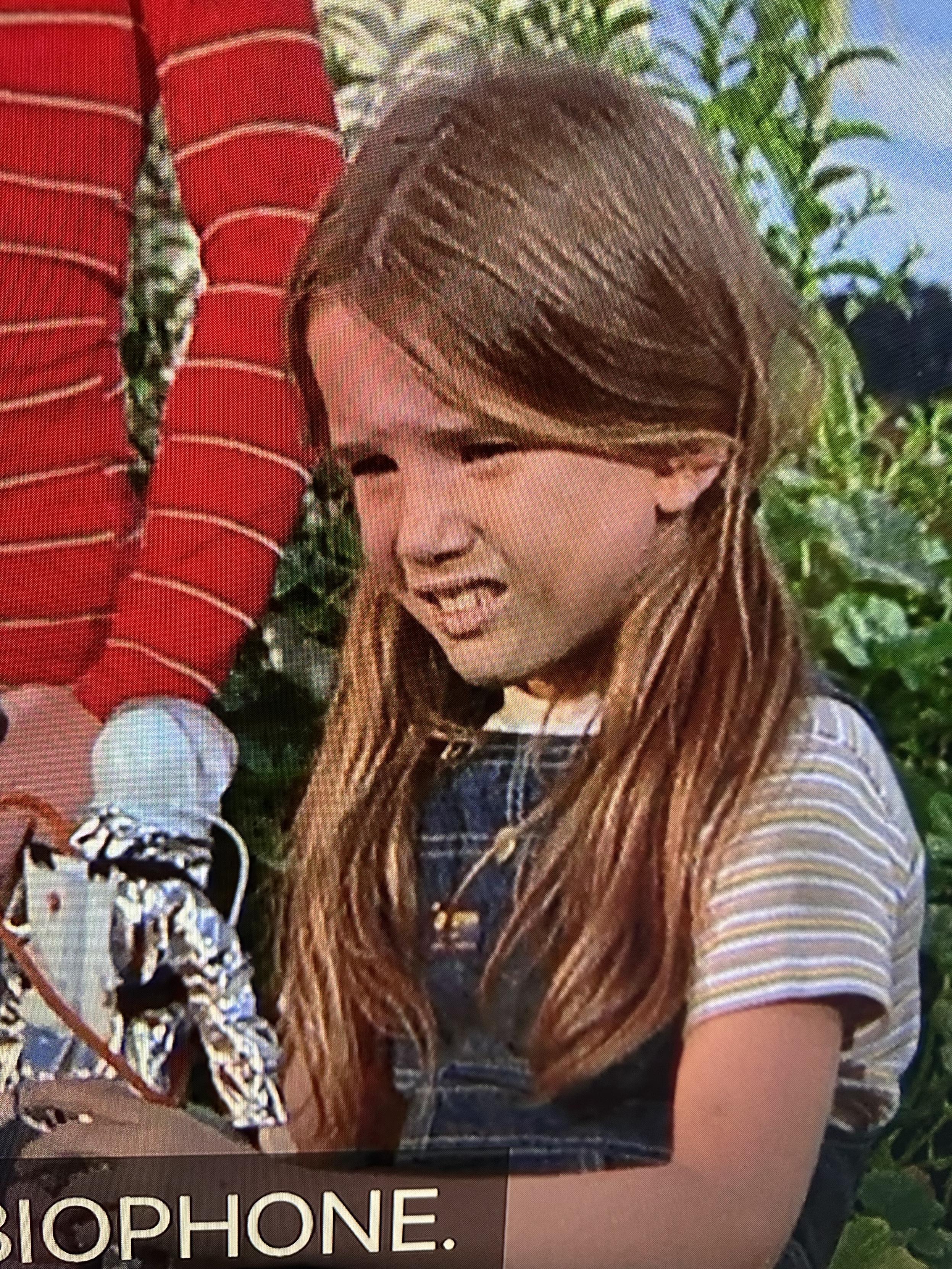 A close-up of young Melissa Gilbert holding a spaceman doll in an uncredited appearance of the TV show emergency from 1972.