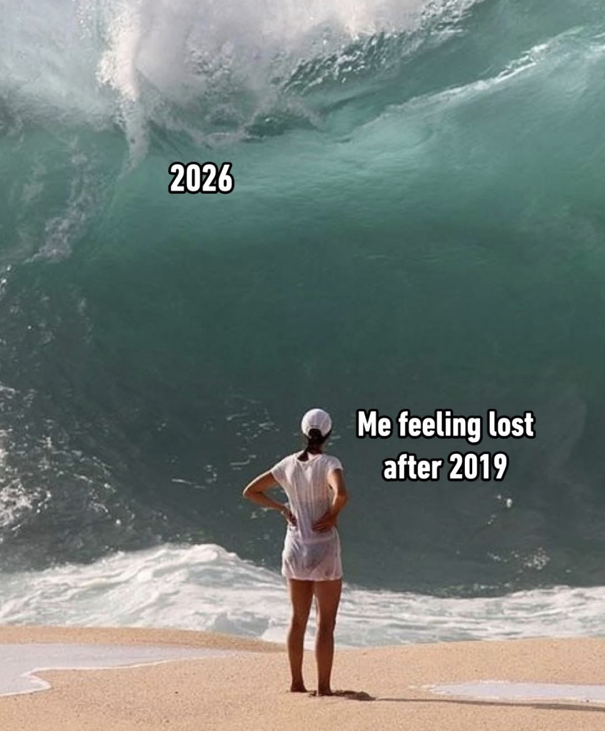 A meme featuring a person in a white shirt and cap standing on a sandy beach, looking out at a massive, towering ocean wave that is about to crash down. The wave is labeled "2026," and the text over the person reads, "Me feeling lost after 2019."