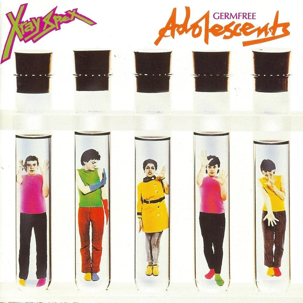 Cover art for Germfree Adolescents by X-ray Spex. The band are all in giant test tubes, wearing day-glo clothes.
