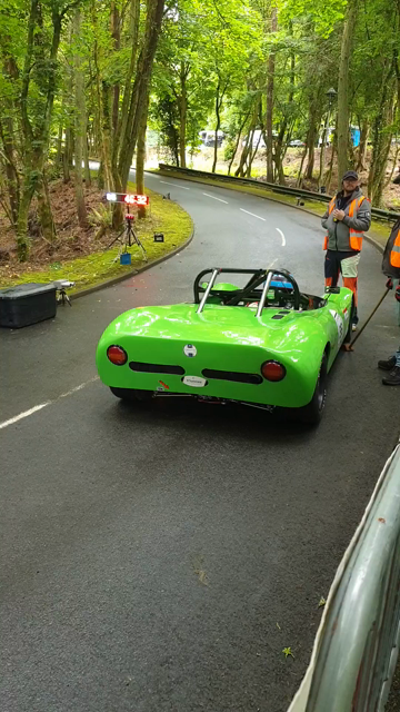 A green Croslé racing car about to compete in a hill climb competition