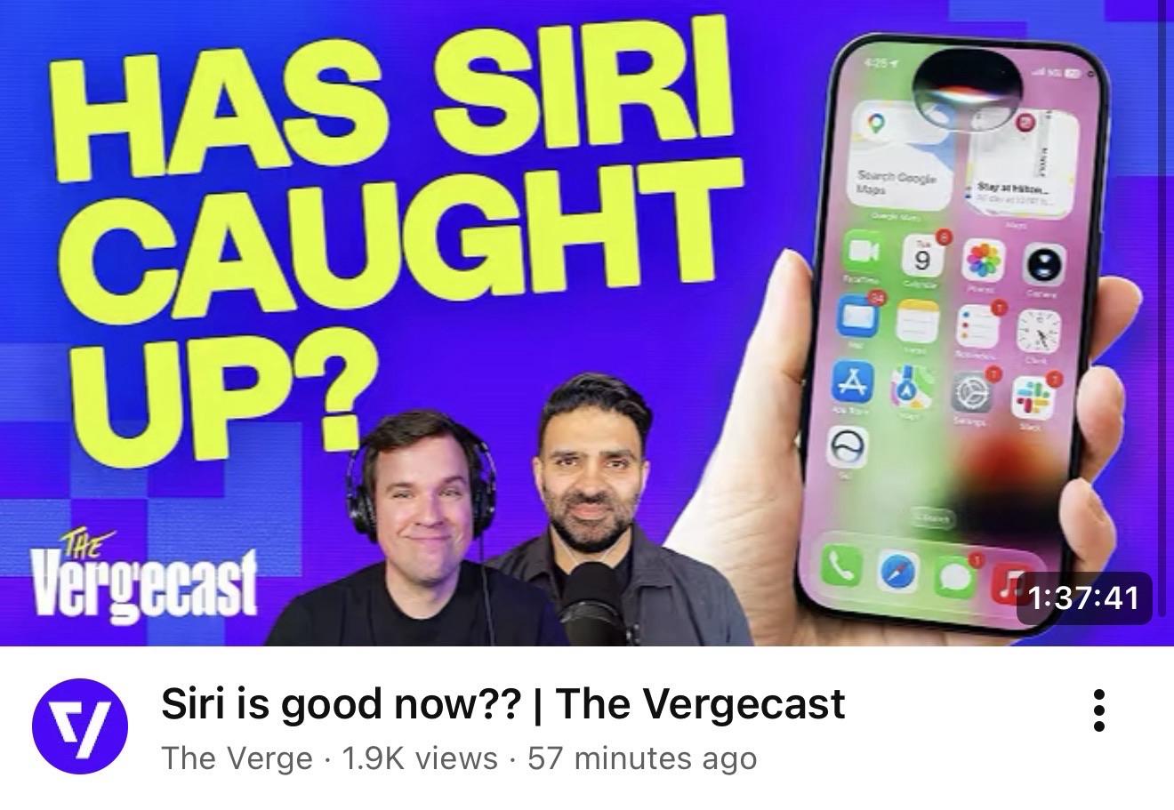 Screenshot of the verge podcast: The image features two men smiling, one wearing headphones. Behind them, a smartphone displays various app icons, with bold text asking, "HAS SIRI CAUGHT UP?" The background is colorful with a mix of purple and blue hues, and the image