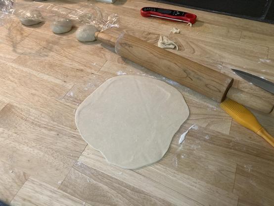 A rolled out tortilla.