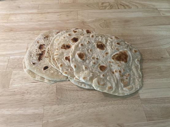 A bunch of fresh home/hand made tortillas.