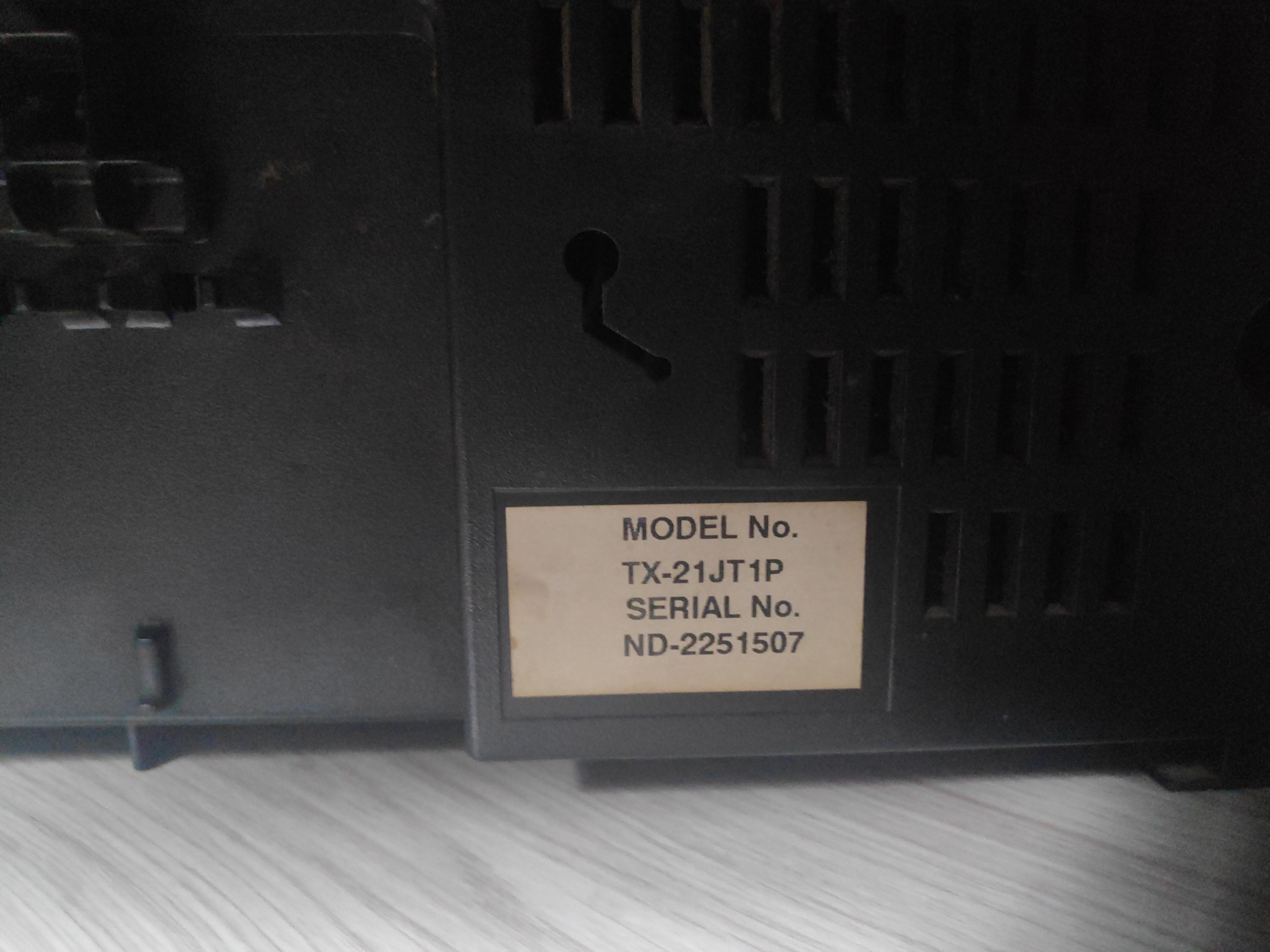 Here it says:

MODEL No.

Tx-21JT1P
SERIAL No.
ND-2251507