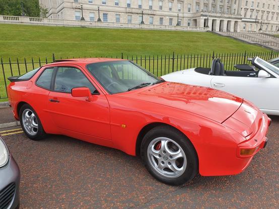 A Guards Red 1986(1987?) Porsche  944, outside the parliament buildings at Stormont, Belfast, Northern Ireland.
