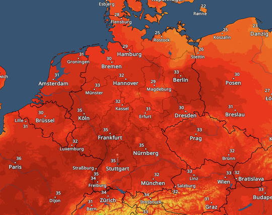 Weather heat map of Germany, shaded deep red, showing widespread extreme heat. City labels include Hamburg (29°C), Berlin (33°C), Hanover (32°C), Cologne (35°C), Frankfurt (35°C), Stuttgart (35°C), Nuremberg (35°C), and Munich (32°C).