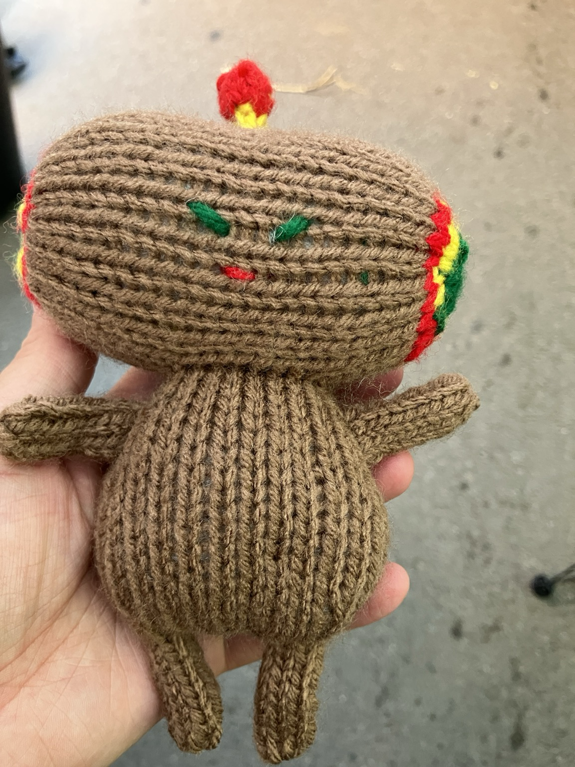Knit plush of an all brown “naked” Katamari cousin