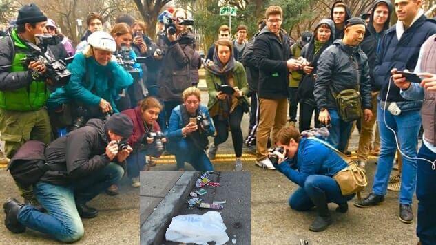 Picture from a small portion of DisruptJ20 marchers with a bunch of photojournalists clustered around a burning trashcan laying on its side by itself on the street

In this picture the burning trashcan has been replaced by a plastic trash bag and some minor litter laying in the street filmed by WCVB5