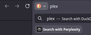 Screenshot of the firefox search bar. Typed into it is 'plex'. Below, there's a suggested popup to 'Search with Perplexity', an AI slop company.