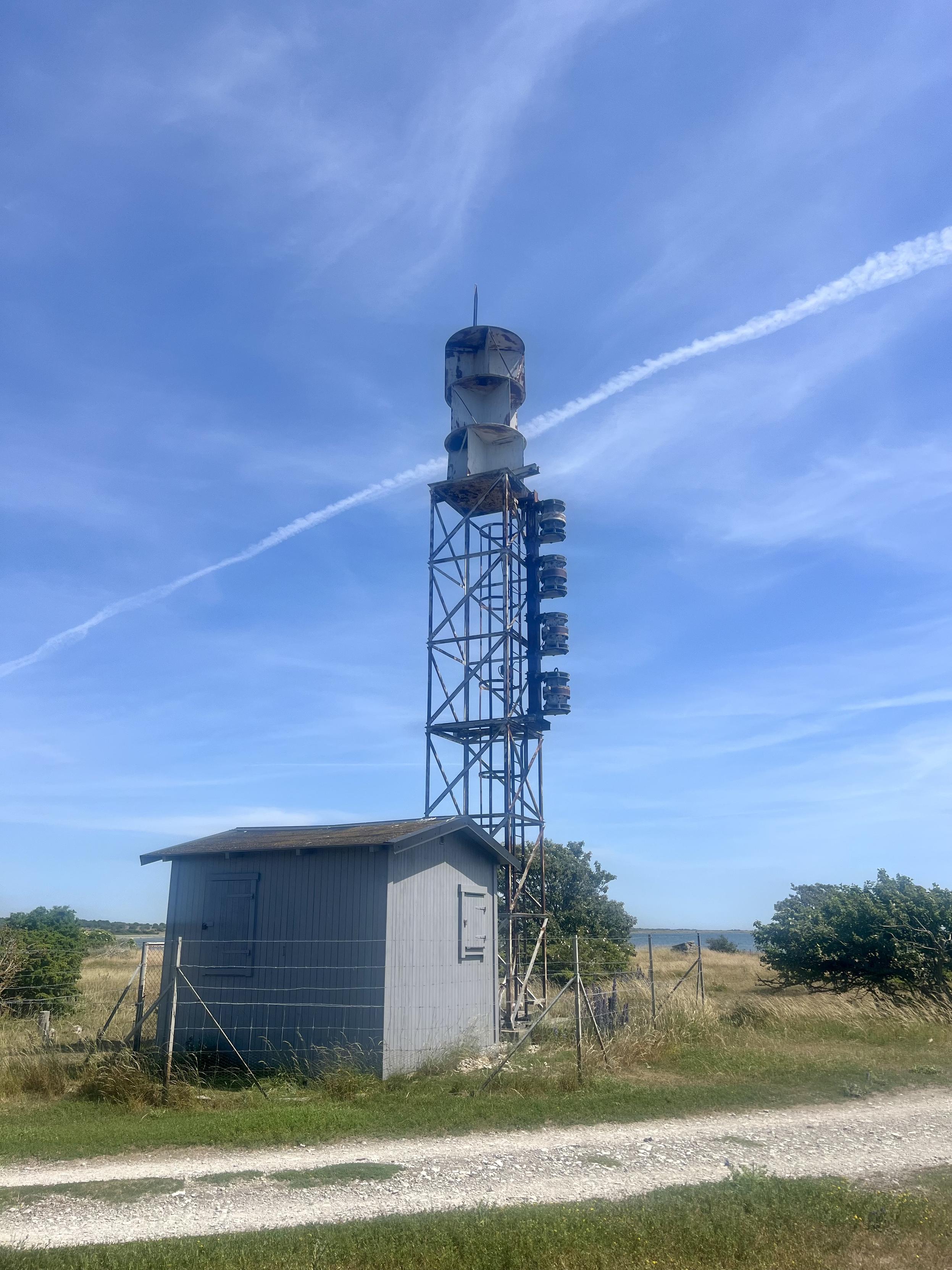 And old signal mast. Or tower. Not sure what it was used for. There’s a small cabin next tonit. The tower has strange objects attached to it and on top something that looks like a magnified version of those.