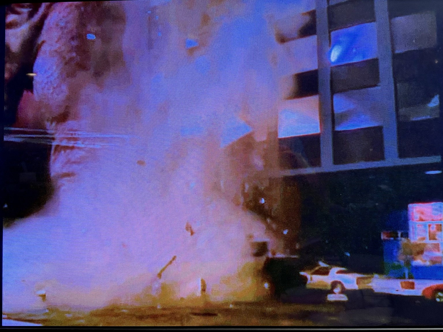Screen shot from the movie “Zarkorr the Invader” in which a model Pontiac Firebird (apparently a model of the star car from “The Rockford Files”) is crushed by a collapsing model skyscraper.