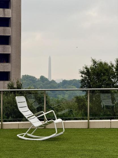A view of the Washington Monument from Freedom Park with a rocking chair on the lawn