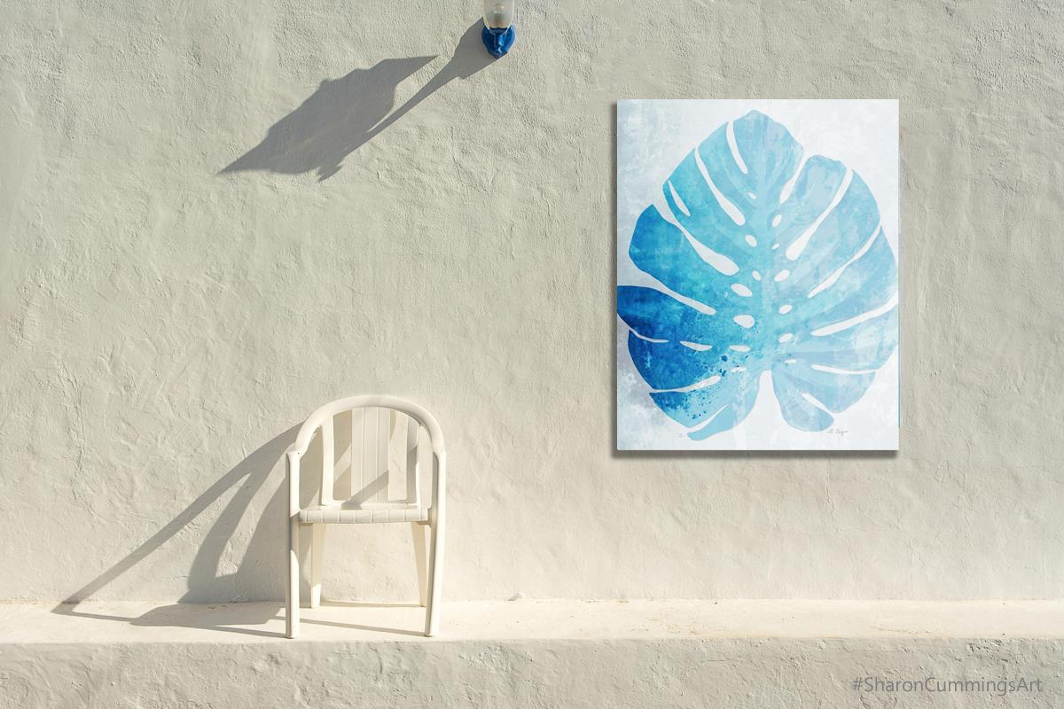 Blue Monstera Leaf on white in a furniture setting by Sharon Cummings.
