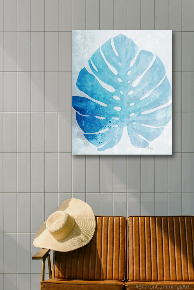 Blue Monstera Leaf on white in a furniture setting by Sharon Cummings.