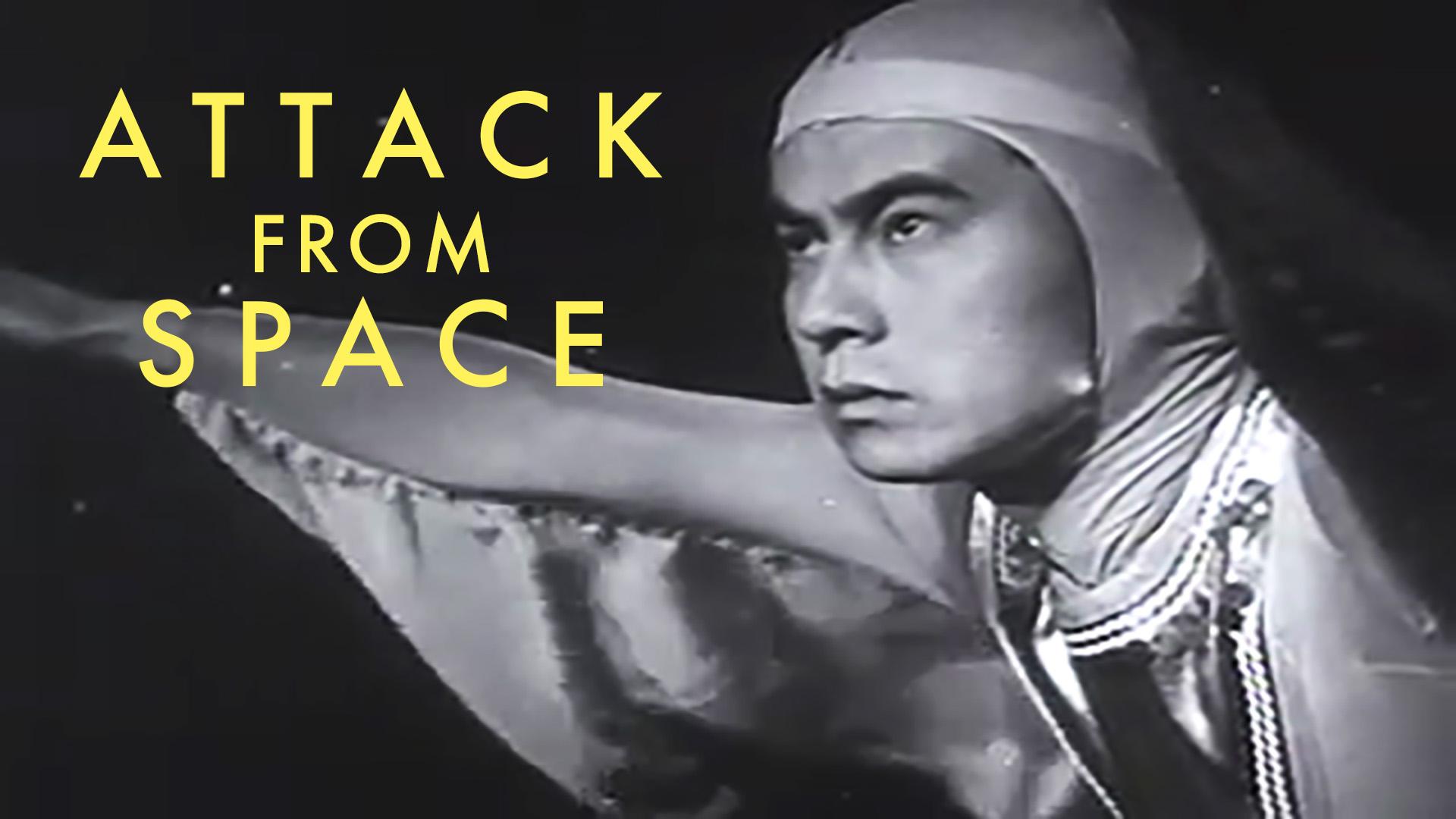 A black and white film still features a person against a dark background with yellow text in the upper left corner. The text reads "ATTACK FROM SPACE". An individual wearing a light-colored, hooded garment is positioned on the right side of the frame, looking toward the left. Their arm extends horizontally towards the left edge of the image. Detailed fabric textures and patterns are visible around the neck area of the person's clothing.