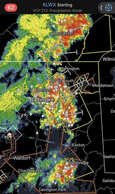 Screenshot of a radar app showing a massive electrical storm over Baltimore 