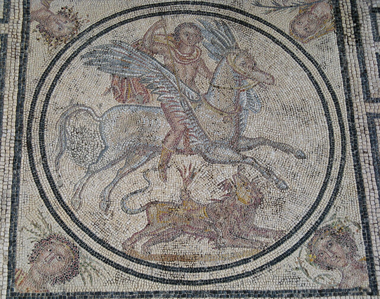 Roman mosaic of the Greek hero Bellerophon riding the winged horse Pegasus as he is slaying the Chimera. Fire is show to emerge from the Chimera's mouths, both the lion's mouth and the goat's mouth. There is no block of lead on Bellerophon's spear, so he either already placed it or he is yet to come up with that idea.
The mosaic was created in the 2nd to 3rd centuries CE.