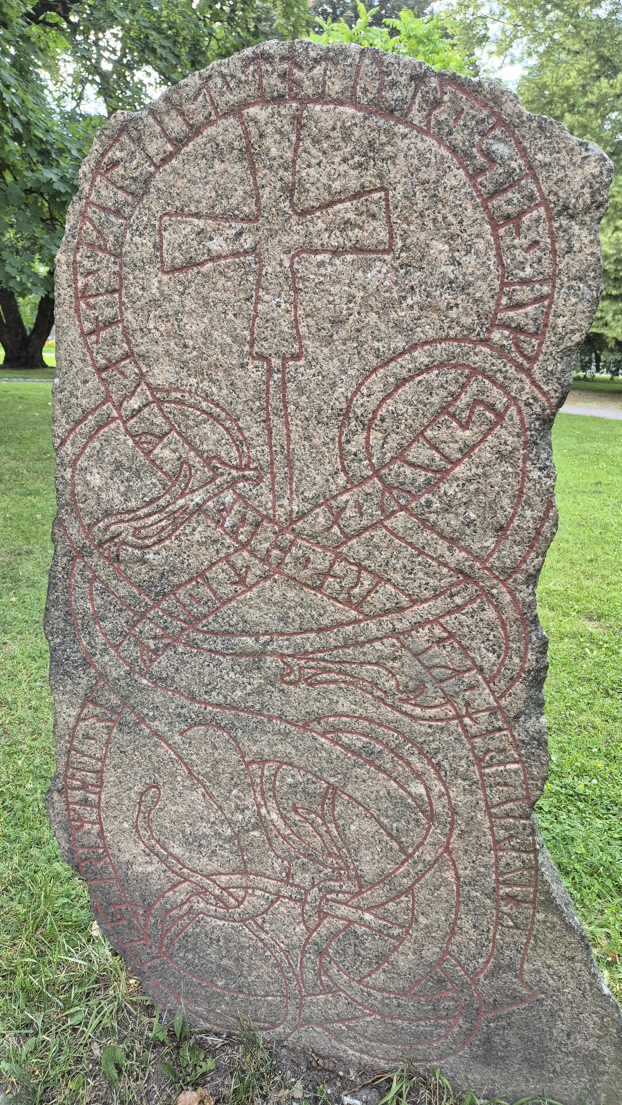 Runestone in a park.
