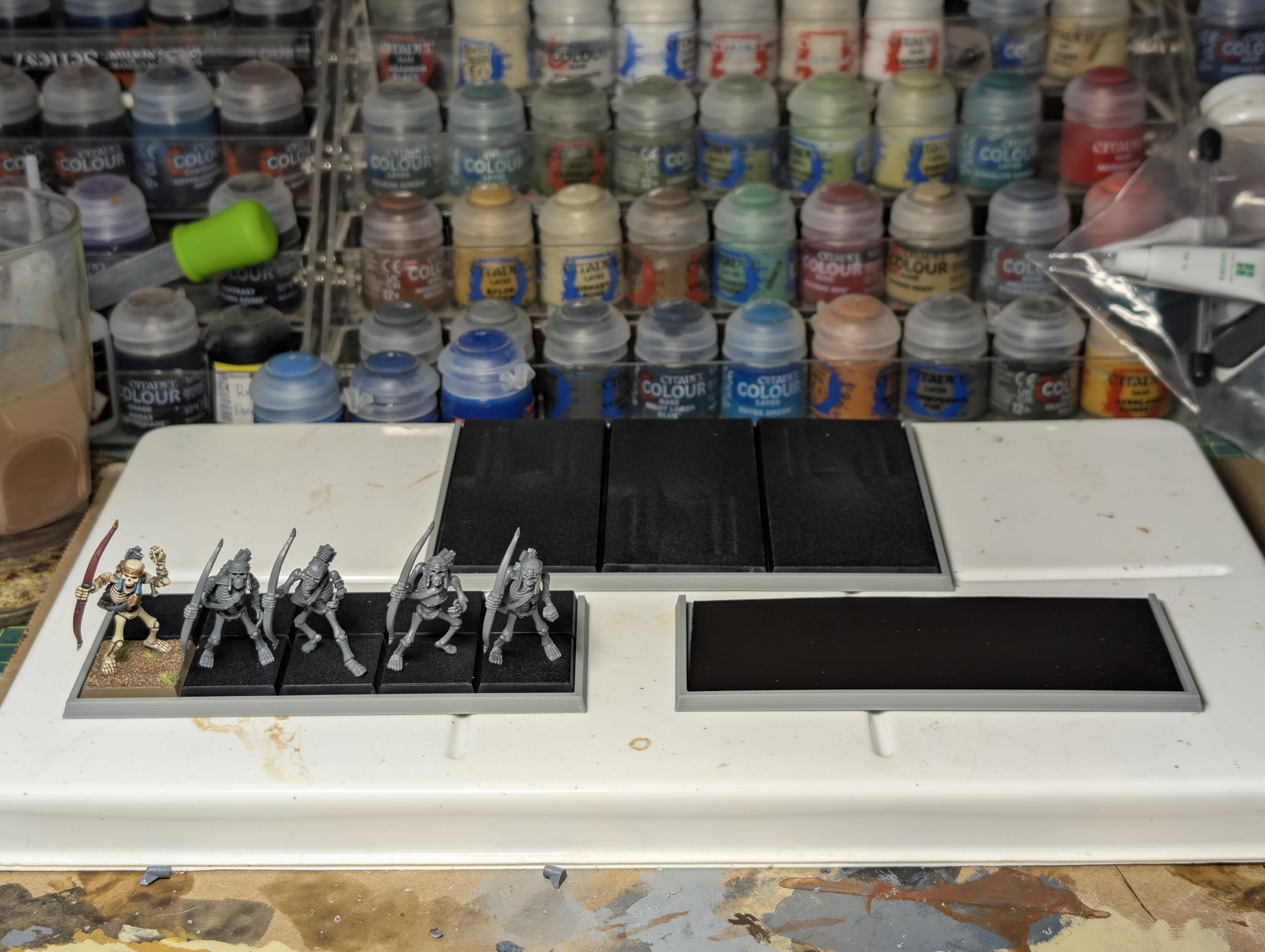 Partially filled movement trays of Tomb Kings skeleton archers, Warhammer