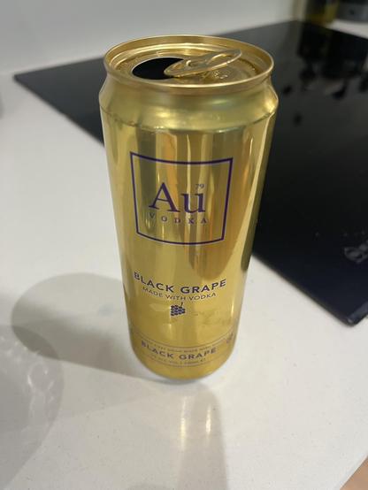 A fancy gold tin of black-grape vodka