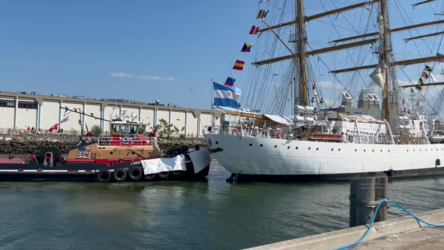 Video clip of a three mastered tall ship being pushed into a docking area in Boston Harbor