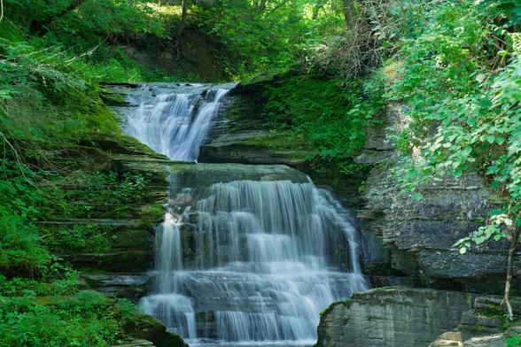 Waterfall alternates from the left to the right in the center of the frame;  the shale rock it runs over is tack-sharp but the water looks soft and smooth because I shot it with a long exposure