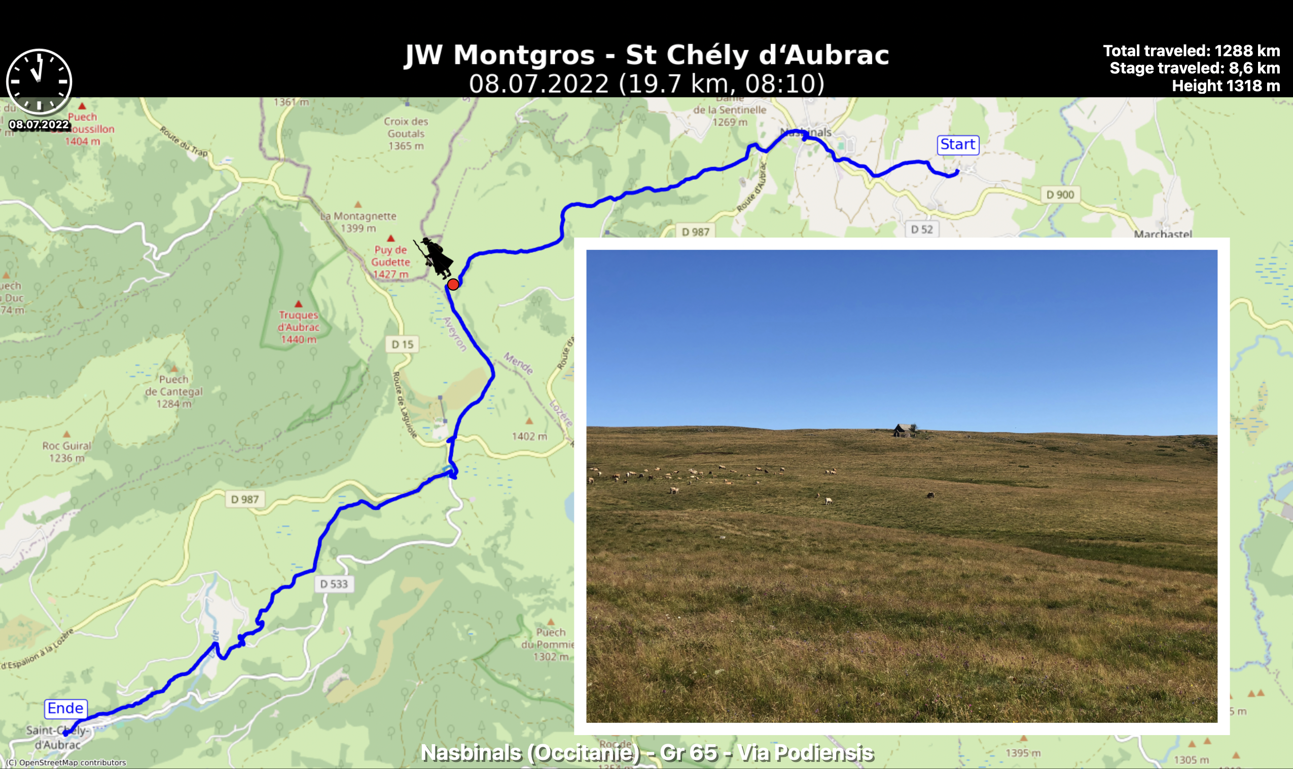 Map of a hiking route from JW Montgros to St Chély d'Aubrac, dated July 8, 2022. Displays total distance, elevation, and a photo of a grassy landscape with grazing sheep under a clear blue sky.