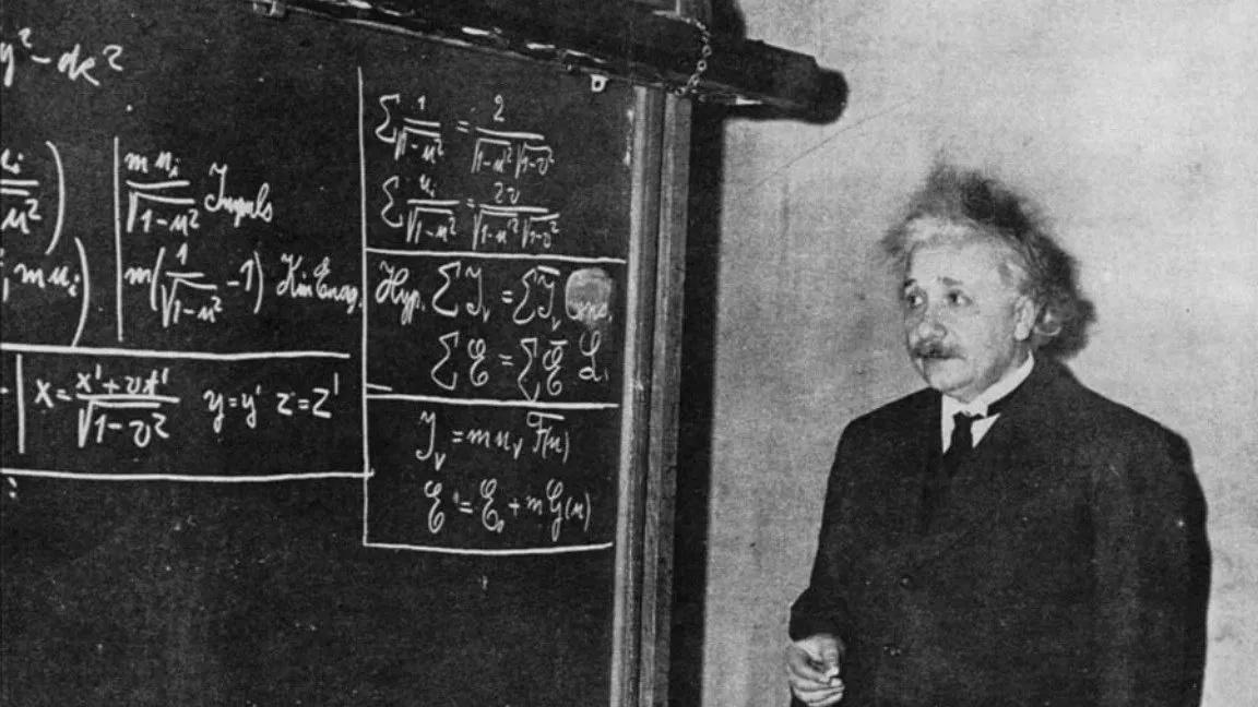 Einstein at a blackboard in 1934, deriving special relativity for an audience.
