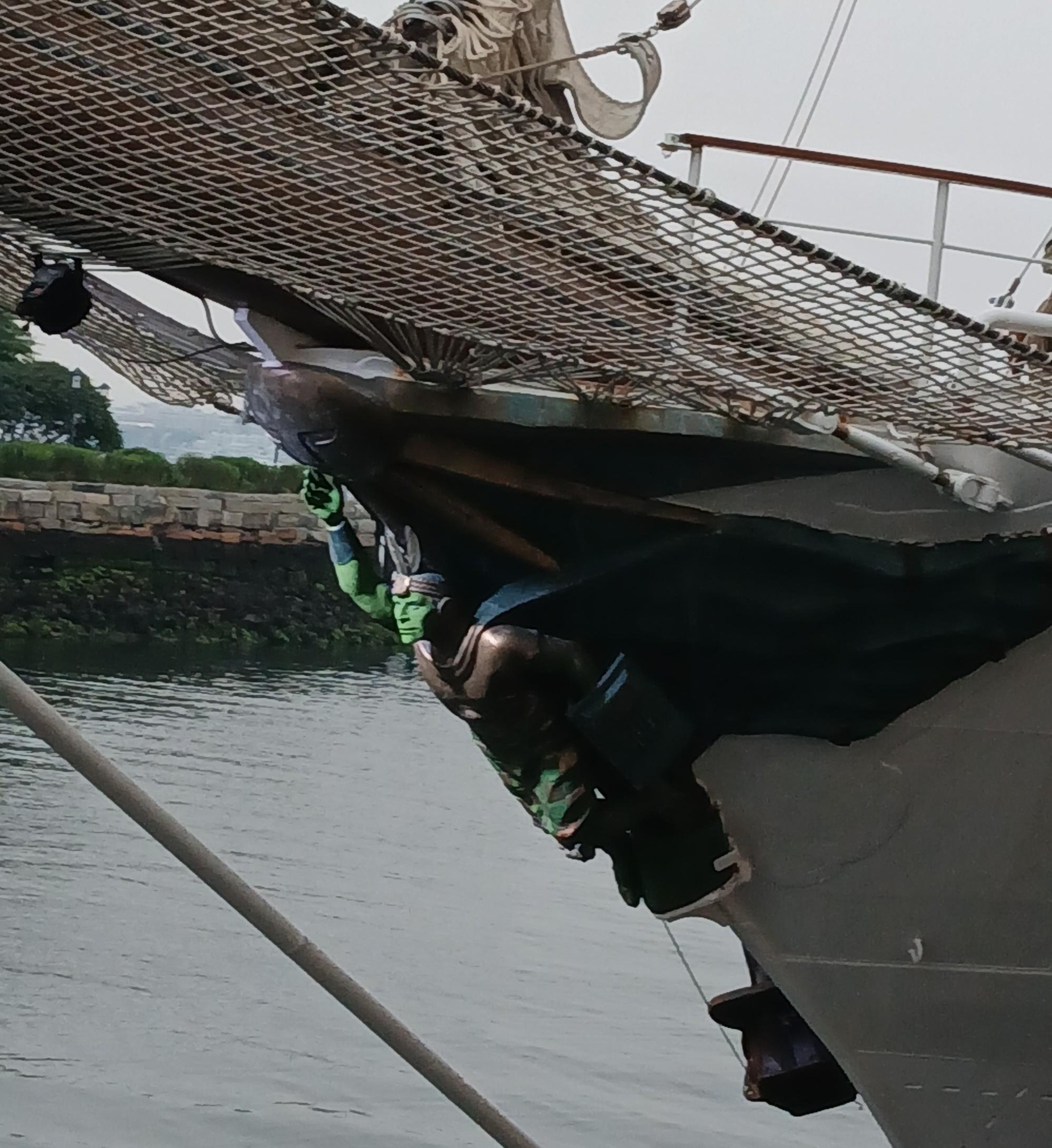 Figure of Peruvian tall ship BAP Unión, a green-faced warlike figure.
