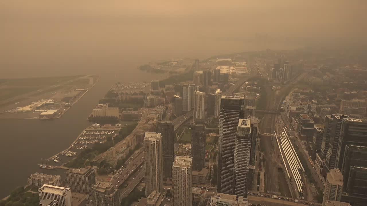 Western view from the CN Tower overlooking Toronto and Lake Ontario. // Image captured at: 2026-07-15 19:00:04 UTC (about 1 min. prior to this post) // Image sourced from: earthcam.com // Current Temp in Toronto: 82 F | 28 C // Precip: overcast clouds // Wind: NW at 10 mph | 16 kph // Humidity: 38%