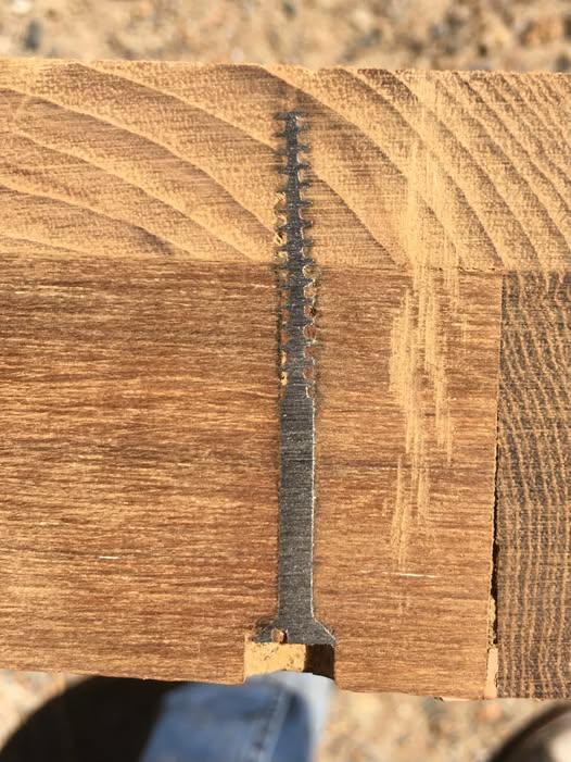 An image of adjoining pieces of wood that have been cut through while simultaneously cross-sectioning and embedded screw.