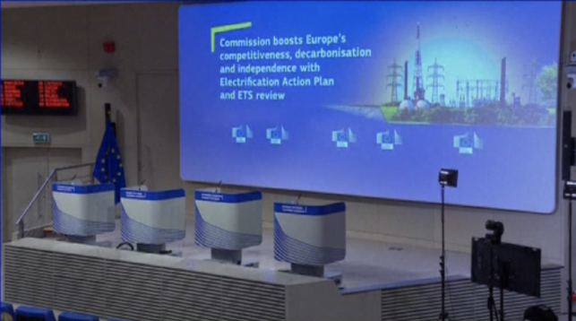Four lecterns side by side, against a blue background, with the European Union flag visible