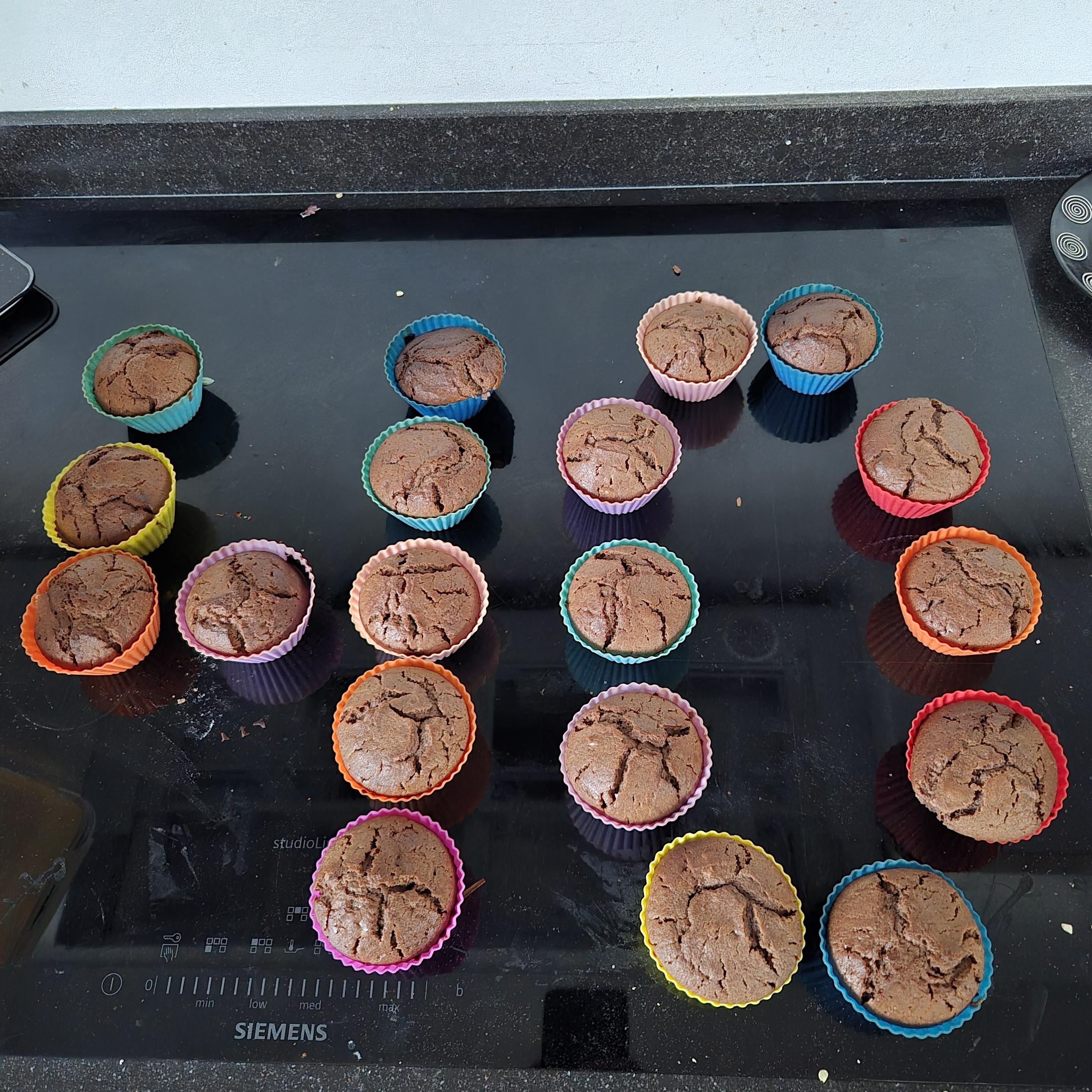 Chocolate-y looking Muffins in colourful silicone cups arranged in the form of the number 40