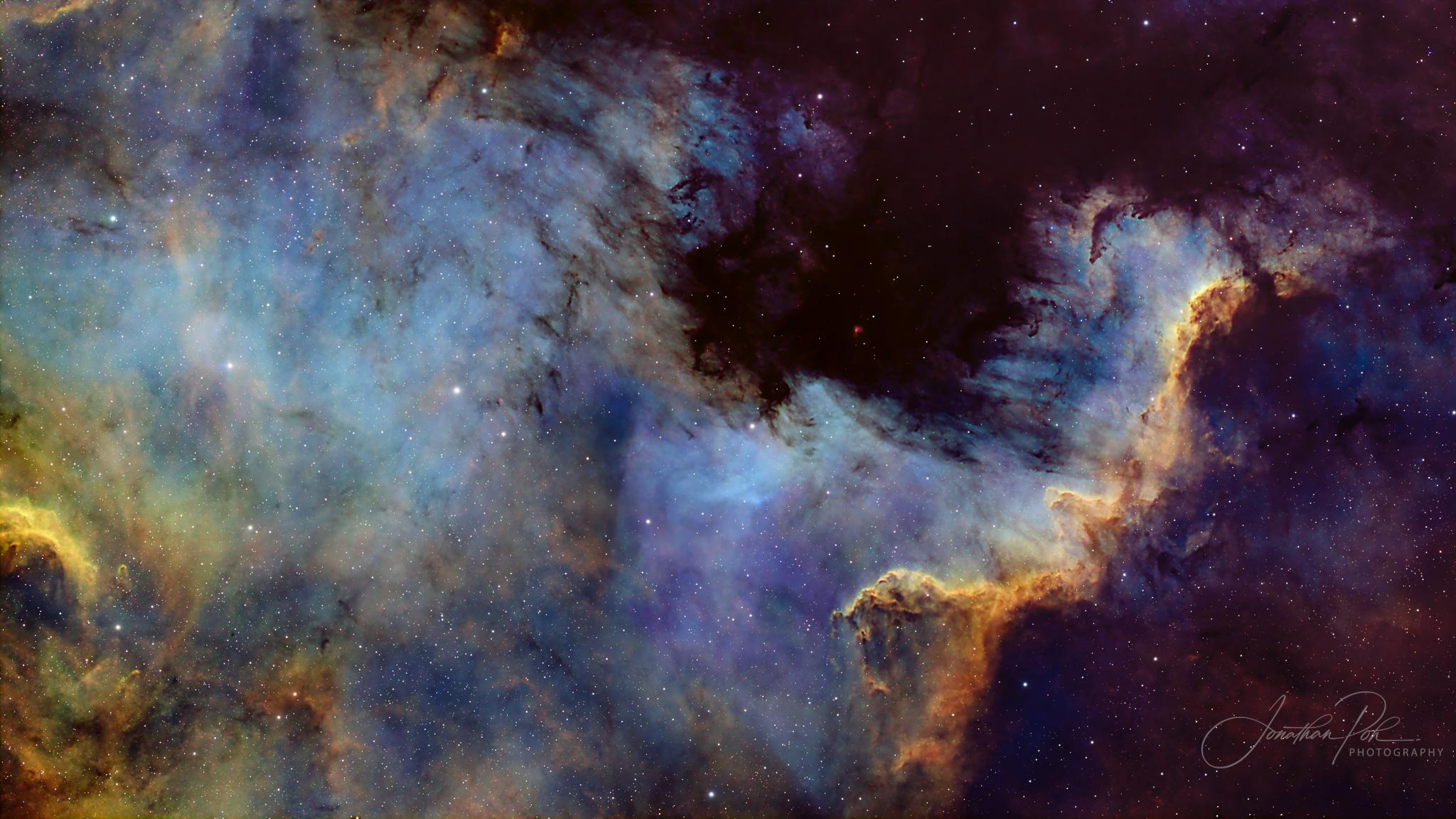 An astrophotography image of the Cygnus Wall in the North America Nebula (NGC 7000)