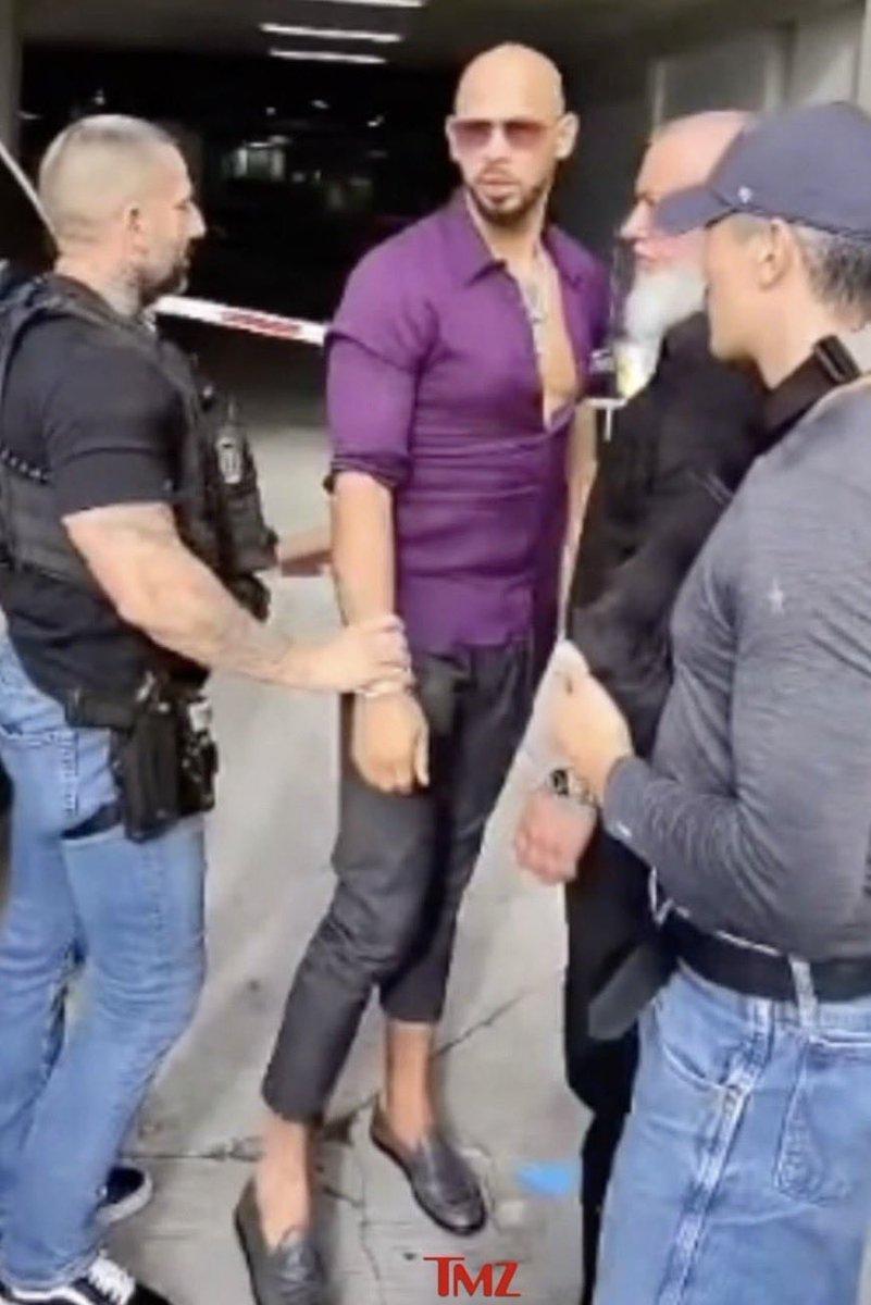 Andrew Tate looking chic while getting arrested