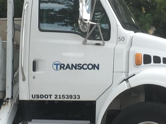 A large truck with a “TRANSCON” logo on the side.