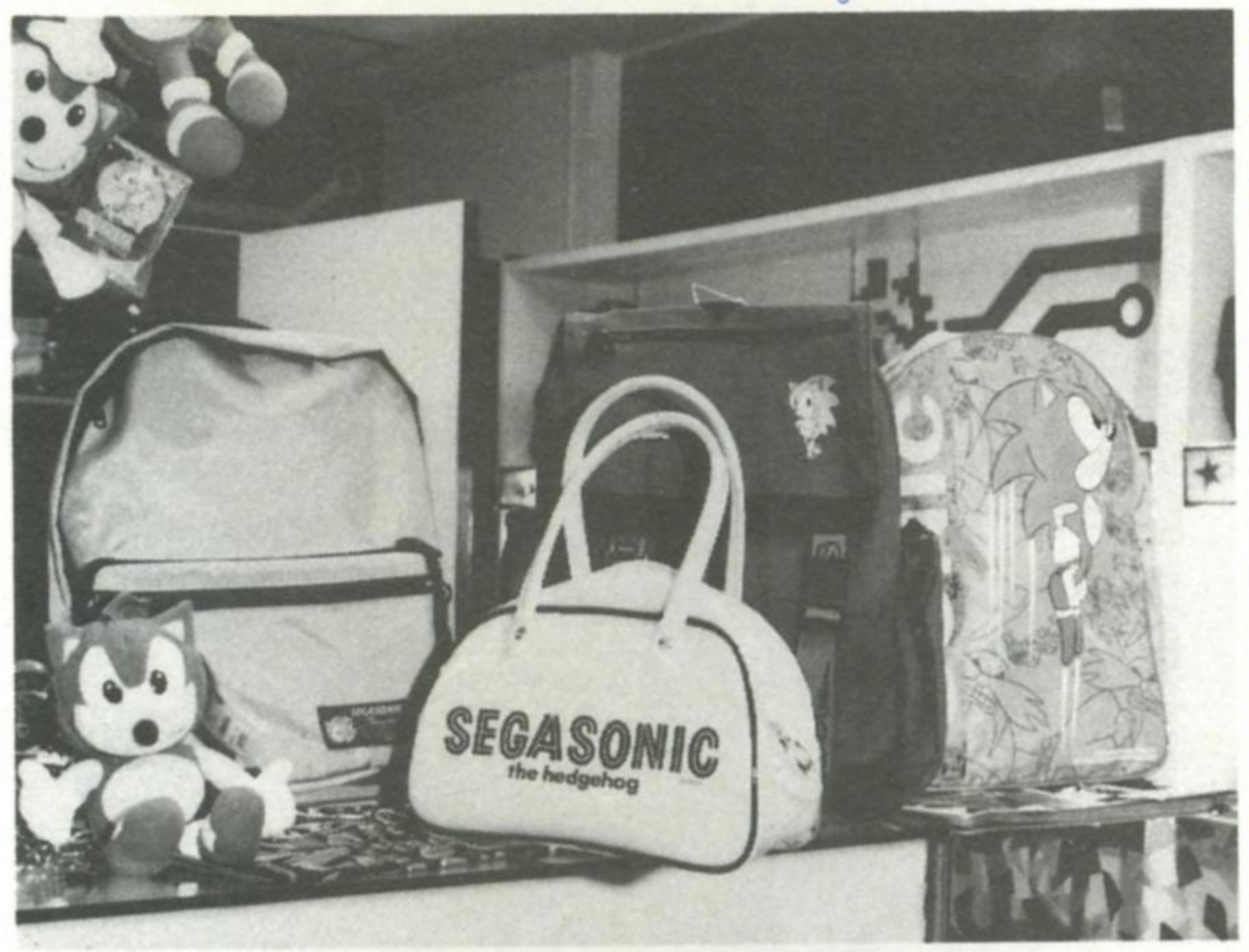 sonic plushies as well as sonic branded bags/satchels/backpacks, all on display.