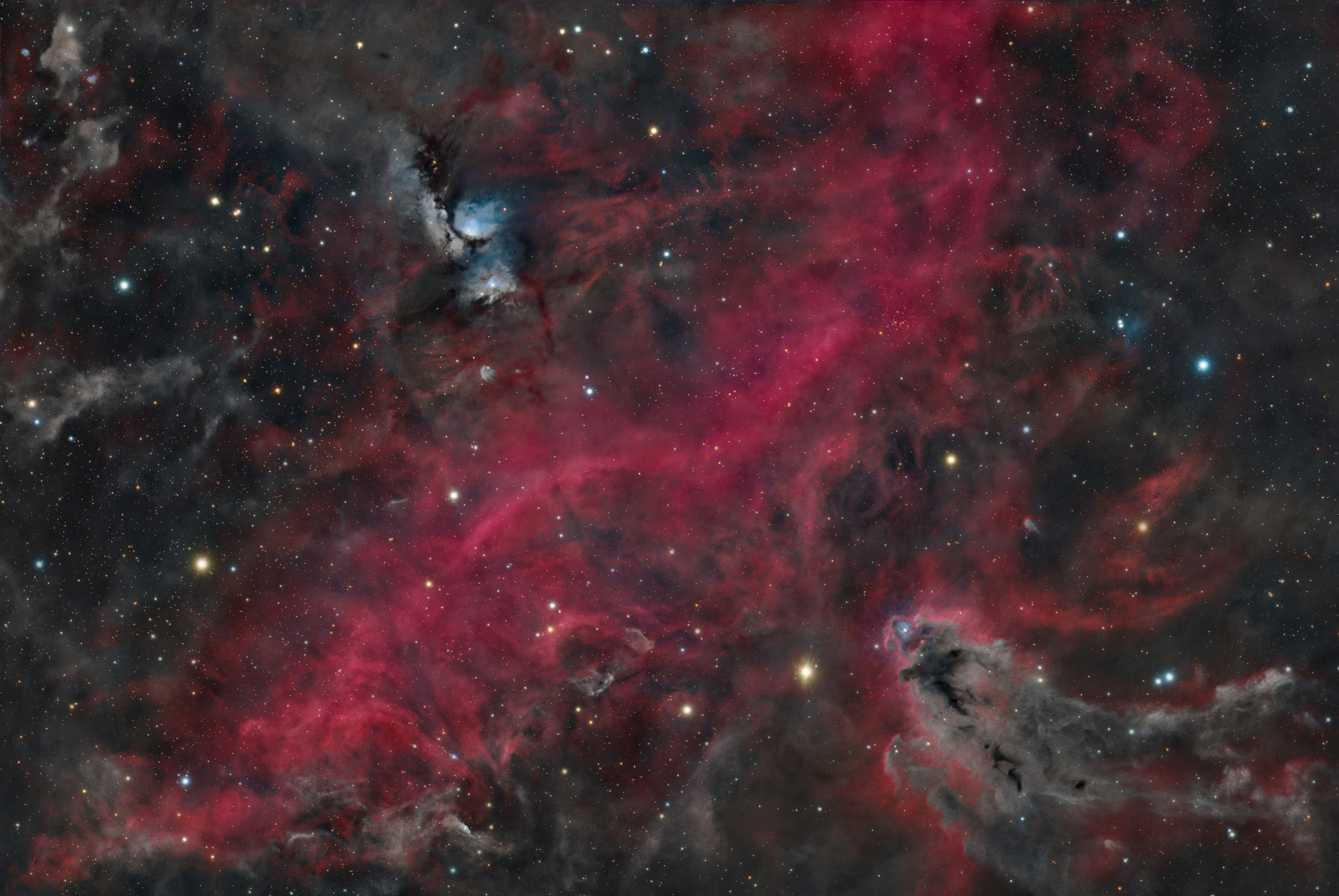This image captures two very different structures within the Orion molecular cloud complex: the bright nebula M78 and the dark nebula LDN 1622. M78 is illuminated primarily by two young B-type stars whose scattered blue light reveals the surrounding dust.