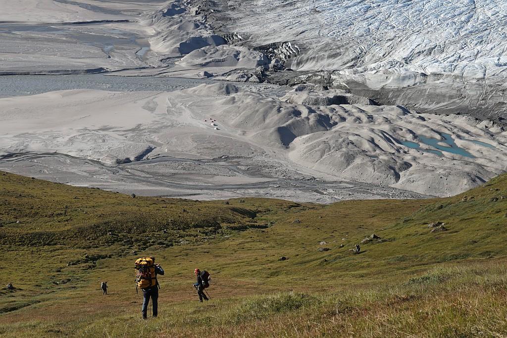 A team of researchers approaching a glacier in Greenland.