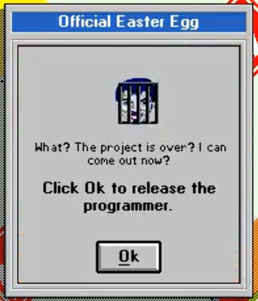 a pixelated face behind bars,
text:
what? the project is over? can i come out now?
click ok to release the programmer.
button: ok