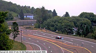 Traffic cam looking east from intersection of US-53 and Piedmont Ave with Lake Superior in the distance. // Image captured at: 2026-07-26 12:46:13 UTC (about 2 min. prior to this post) // Image sourced from: windy.com // Current Temp in Duluth: 69 F | 20 C // Precip: overcast clouds // Wind: SSW at 2 mph | 4 kph // Humidity: 95%