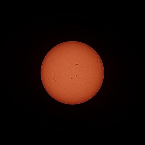 The full disk of the sun with some sun spots. Taken this afternoon from Reykjavík with a Seestar S30