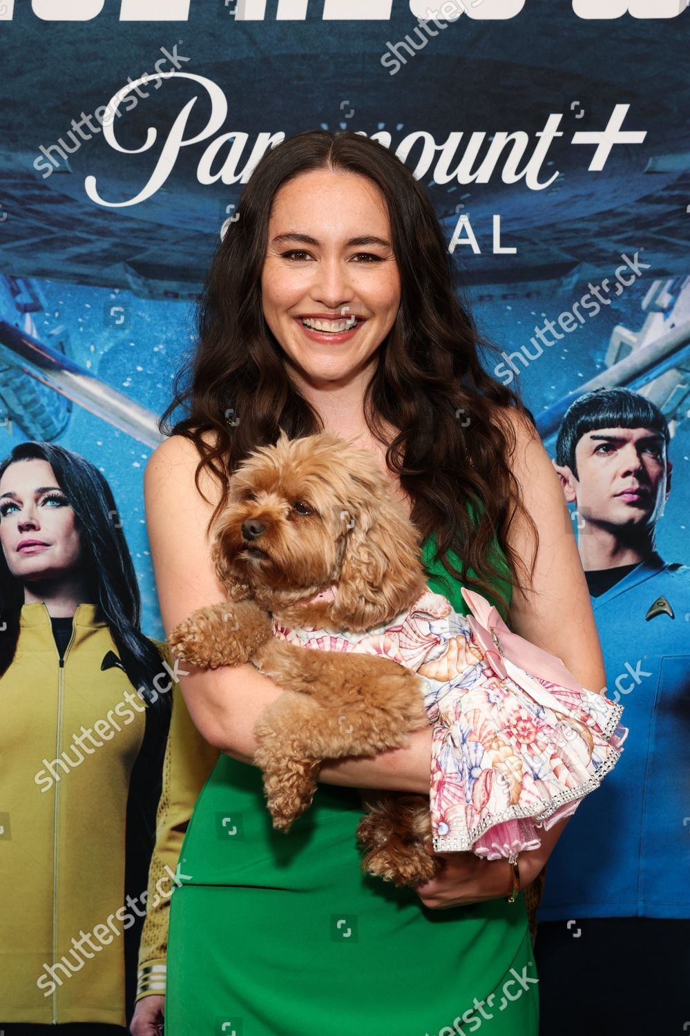 Christina Chong with her cute dog in a frilly dress at the Screening of SNW episodes 401 + 402 at SDCC. She wears a long green tube dress.