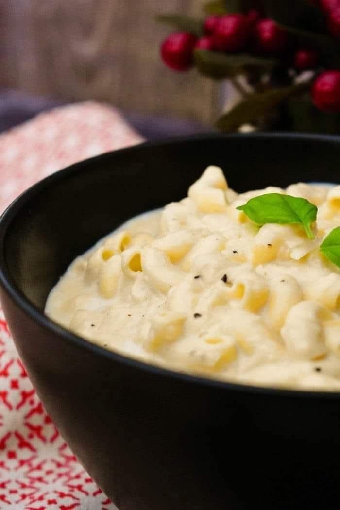 Bowl of creamy, cheesy mac and cheese.