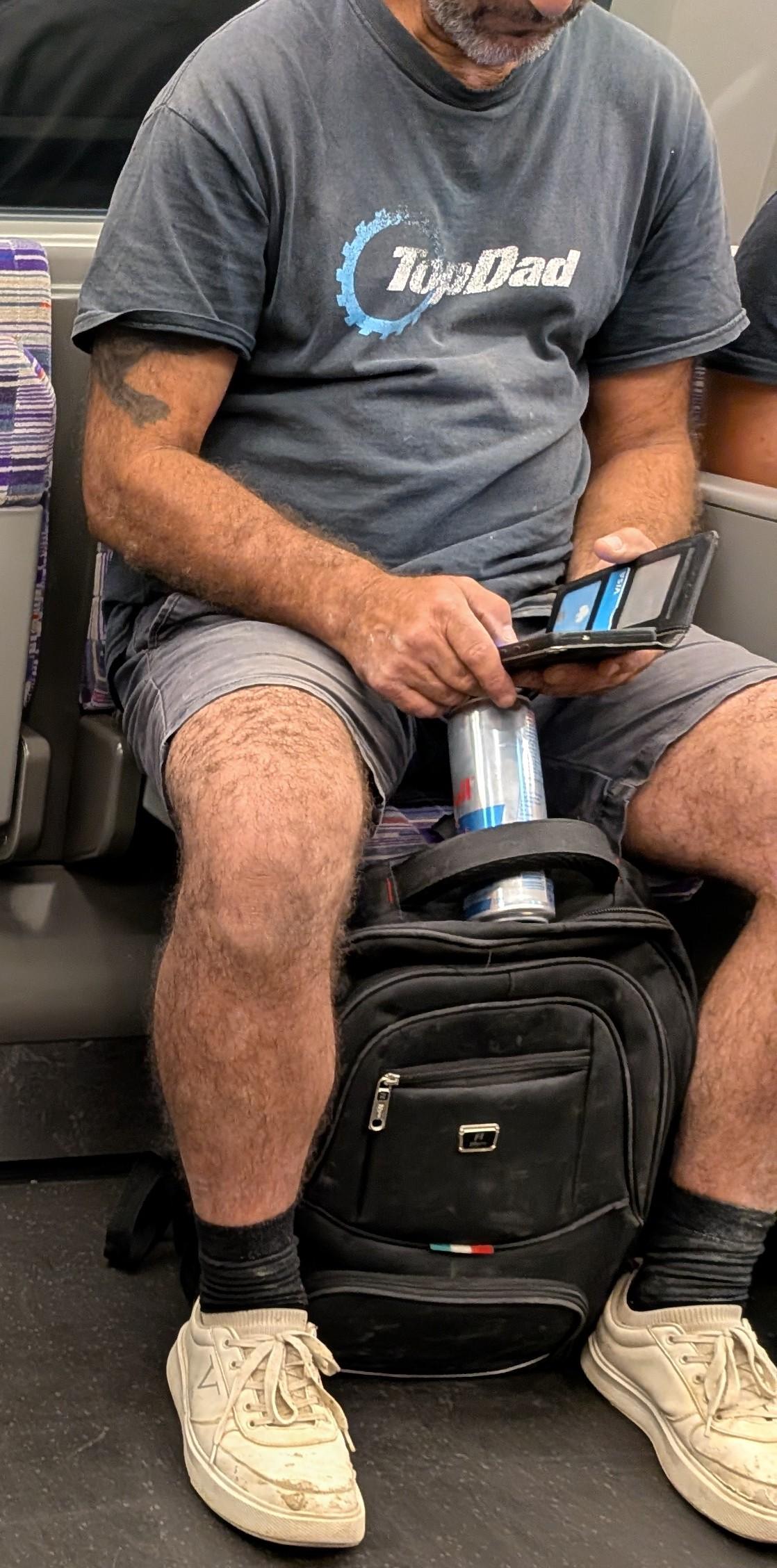 An older guy on the train wearing a 'top gear' style t-shirt that's been changed to say TopDad