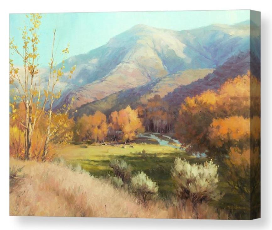 Hills and stream in an autumn landscape.